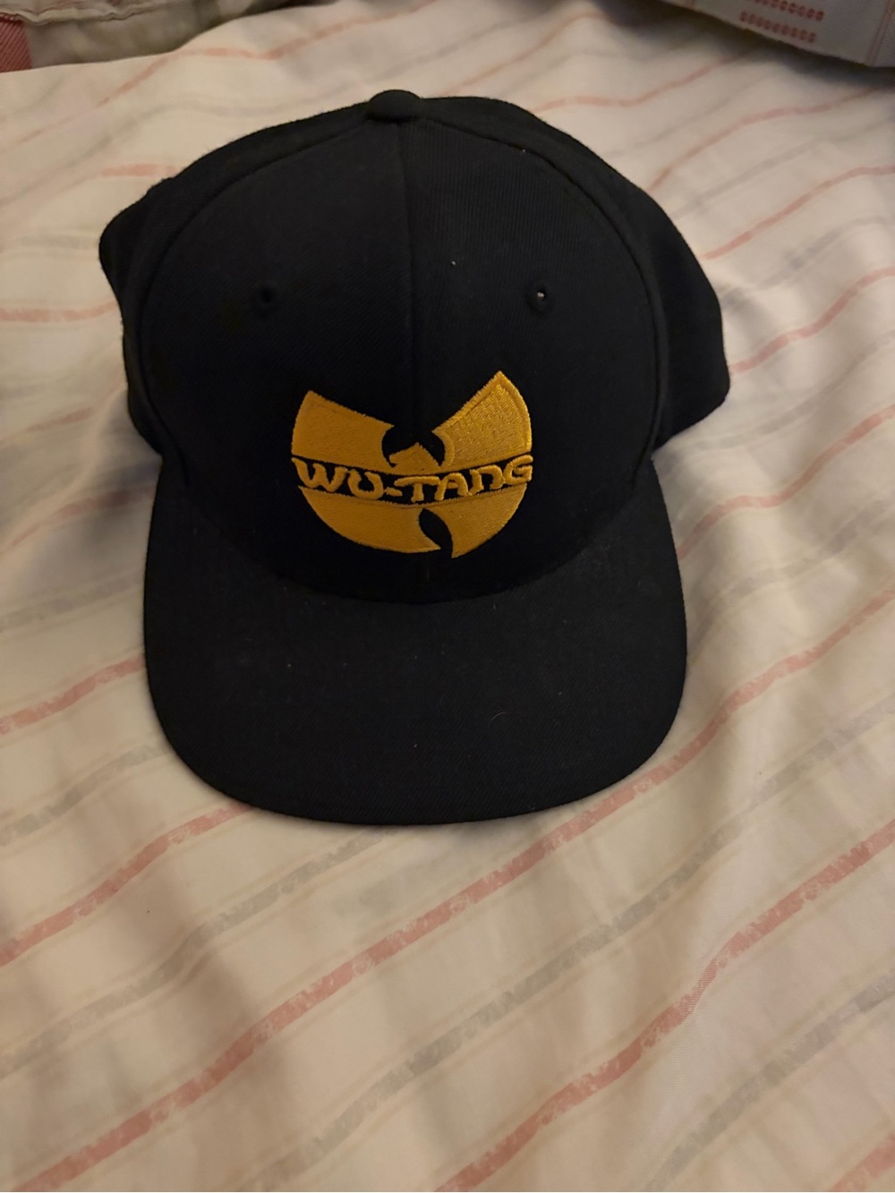 The Classic Black Hat with Yellow Wu-Tang Logo